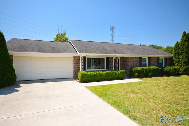 ranch-style home with a garage and a front lawn