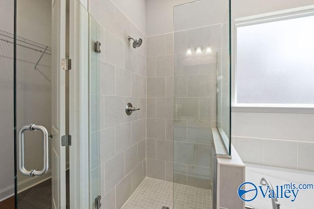 full bath featuring a shower stall