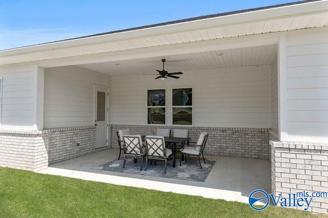 view of patio / terrace with outdoor dining space and ceiling fan