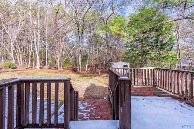 deck with a storage shed