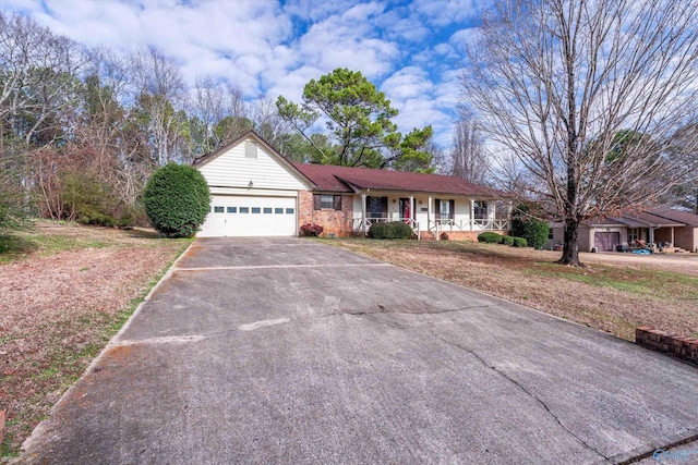 view of front of house featuring covered porch and a garage