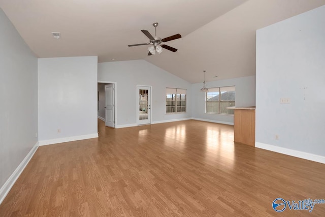 unfurnished living room with lofted ceiling, light hardwood / wood-style flooring, and ceiling fan