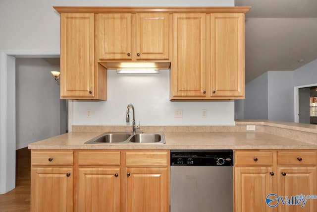 kitchen with light brown cabinetry, sink, and dishwasher