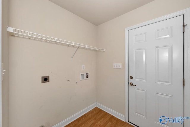 clothes washing area with hardwood / wood-style flooring, hookup for an electric dryer, and hookup for a washing machine