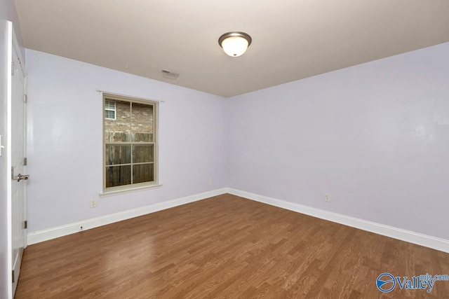 empty room featuring wood-type flooring