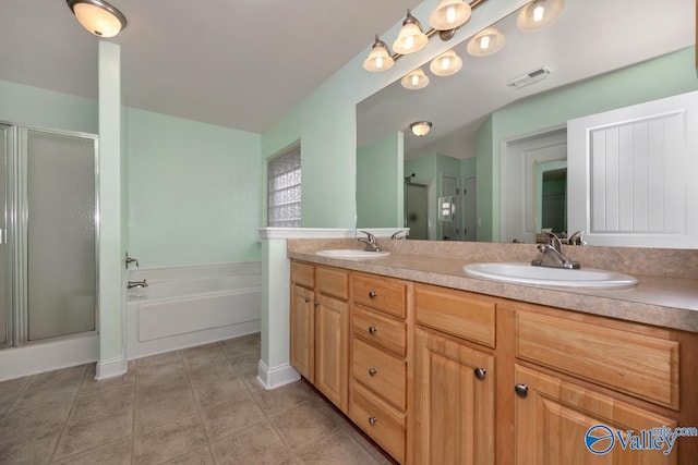 bathroom featuring vanity, tile patterned flooring, and shower with separate bathtub