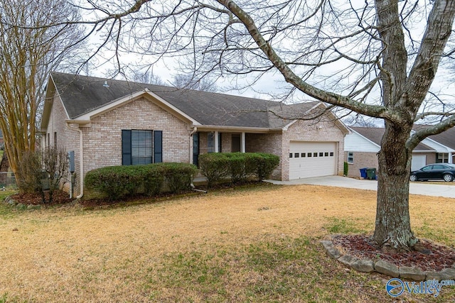 ranch-style home with a garage and a front lawn