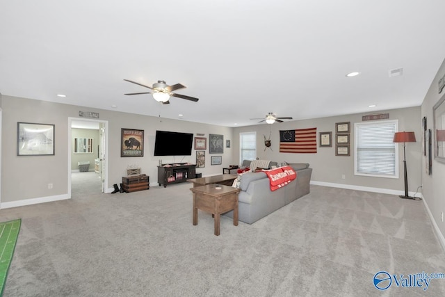 carpeted living area featuring ceiling fan, visible vents, baseboards, and recessed lighting