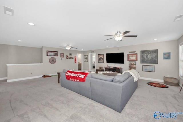 living area with carpet, visible vents, baseboards, and recessed lighting