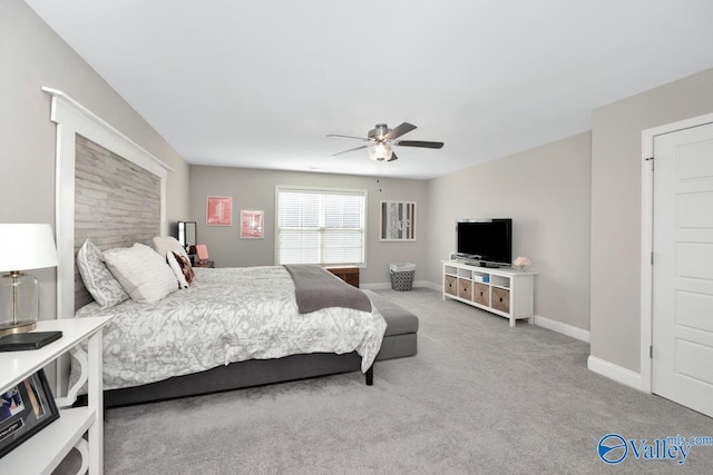 bedroom featuring a ceiling fan, carpet flooring, and baseboards