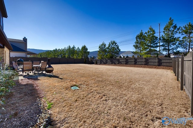 view of yard featuring a patio area and a fenced backyard