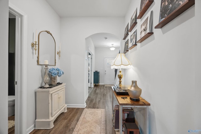 corridor featuring dark wood-type flooring