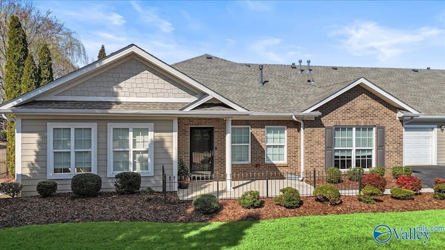 view of front facade featuring a garage, brick siding, roof with shingles, and driveway