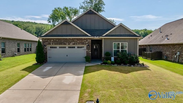 3015 Peevey Creek Ln, Owens Cross Roads, AL 35763 - craftsman inspired home with board and batten siding, a garage, concrete driveway, a front lawn, and brick siding