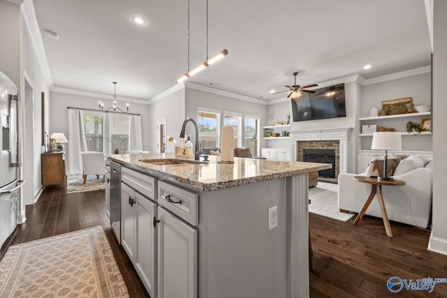 3015 Peevey Creek Ln, Owens Cross Roads, AL 35763 - kitchen with a sink, recessed lighting, a stone fireplace, healthy amount of natural light, and dark wood-type flooring