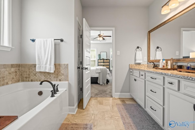 3015 Peevey Creek Ln, Owens Cross Roads, AL 35763 - ensuite bathroom with vanity, a bath, and a ceiling fan