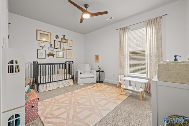 3015 Peevey Creek Ln, Owens Cross Roads, AL 35763 - carpeted bedroom featuring a nursery area, a ceiling fan, and baseboards