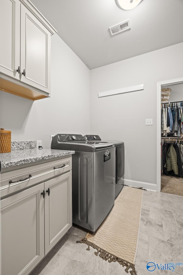 3015 Peevey Creek Ln, Owens Cross Roads, AL 35763 - laundry area featuring independent washer and dryer, cabinet space, and baseboards