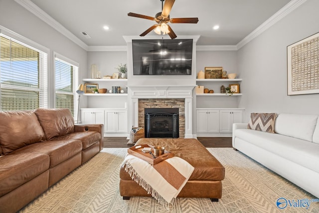 3015 Peevey Creek Ln, Owens Cross Roads, AL 35763 - living room featuring ceiling fan, wood finished floors, ornamental molding, a stone fireplace, and recessed lighting