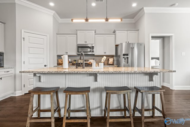 3015 Peevey Creek Ln, Owens Cross Roads, AL 35763 - kitchen featuring stainless steel appliances, backsplash, dark wood-type flooring, crown molding, and baseboards