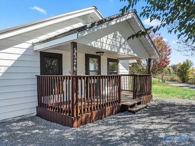 view of side of home with a porch