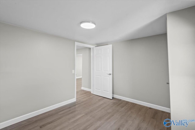 unfurnished room featuring light hardwood / wood-style flooring