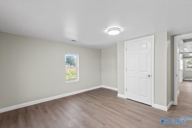 unfurnished bedroom featuring light wood-type flooring