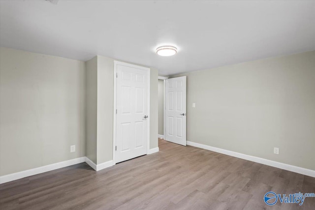 unfurnished bedroom featuring light hardwood / wood-style floors