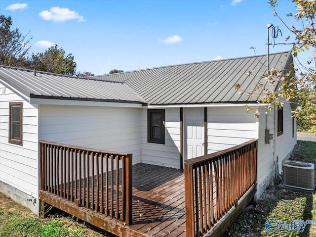 wooden terrace featuring central air condition unit