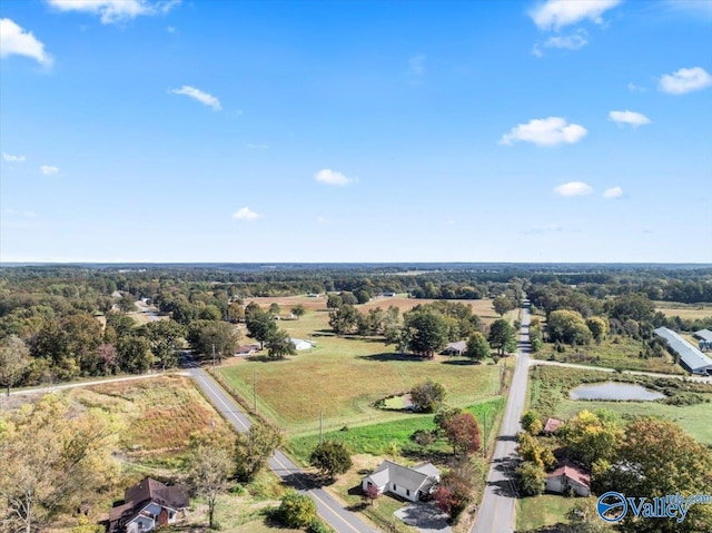 drone / aerial view featuring a rural view and a water view