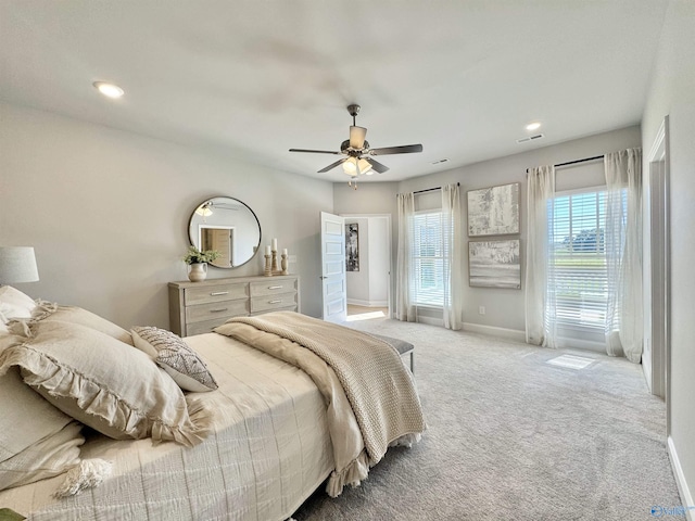 bedroom with ceiling fan and carpet