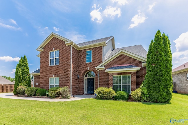 front facade featuring a front lawn