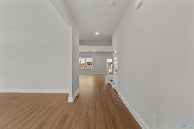 corridor with light colored carpet