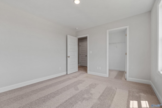 carpeted empty room featuring a wealth of natural light