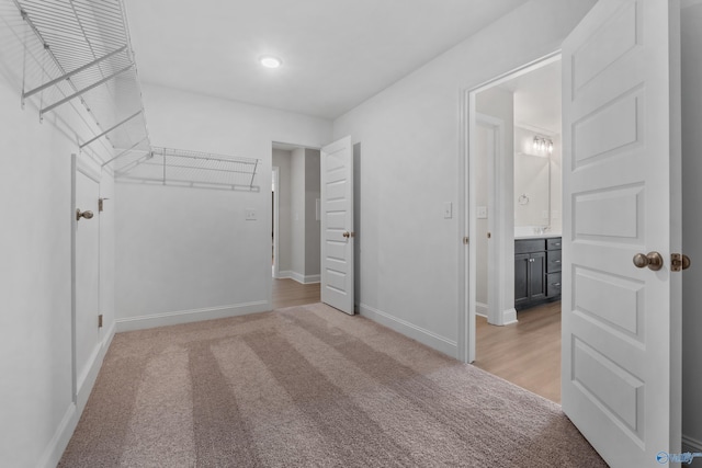 bathroom with vanity, plus walk in shower, wood-type flooring, and a wealth of natural light