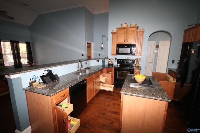 kitchen with kitchen peninsula, dark hardwood / wood-style flooring, ornamental molding, black appliances, and a kitchen island