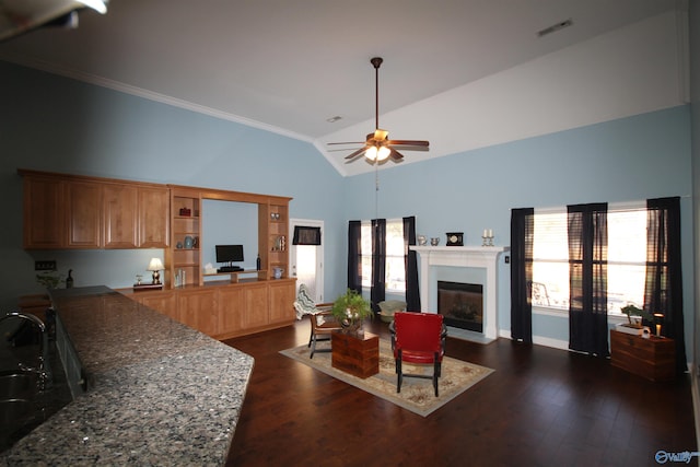 living room featuring ceiling fan, high vaulted ceiling, dark wood-type flooring, and ornamental molding