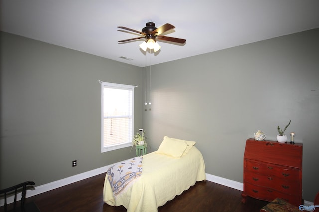 bedroom featuring ceiling fan and dark hardwood / wood-style flooring