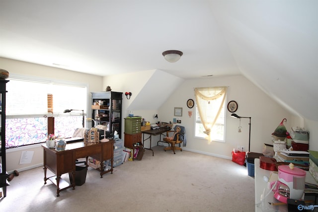 office space featuring light colored carpet and lofted ceiling