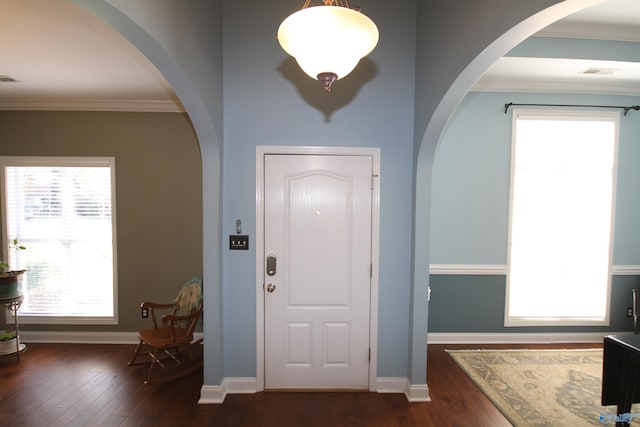 entryway featuring dark hardwood / wood-style floors and ornamental molding