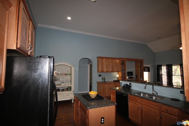 kitchen with a center island, black appliances, sink, vaulted ceiling, and dark hardwood / wood-style floors