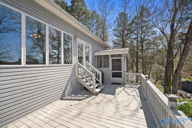 deck with a sunroom