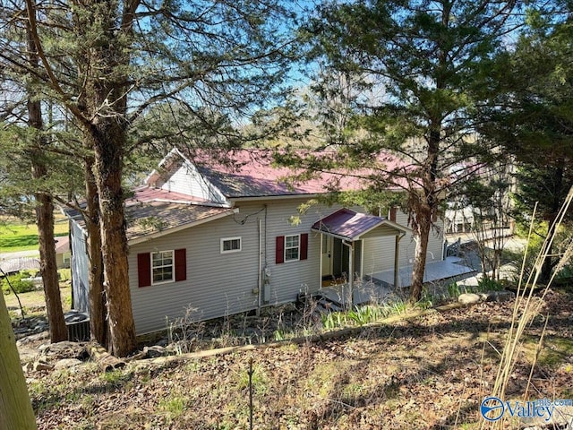 view of side of home with a patio