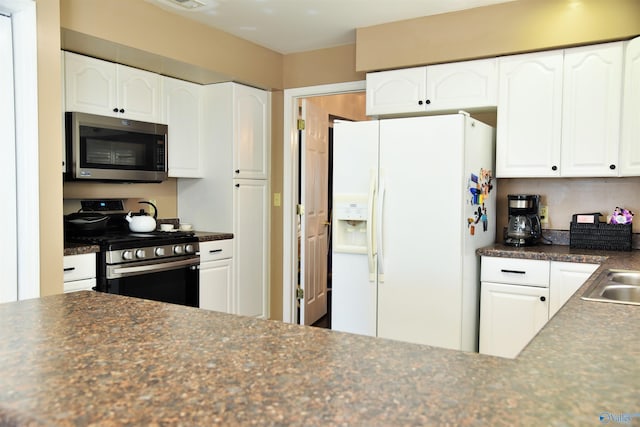 kitchen with white cabinets, sink, and appliances with stainless steel finishes