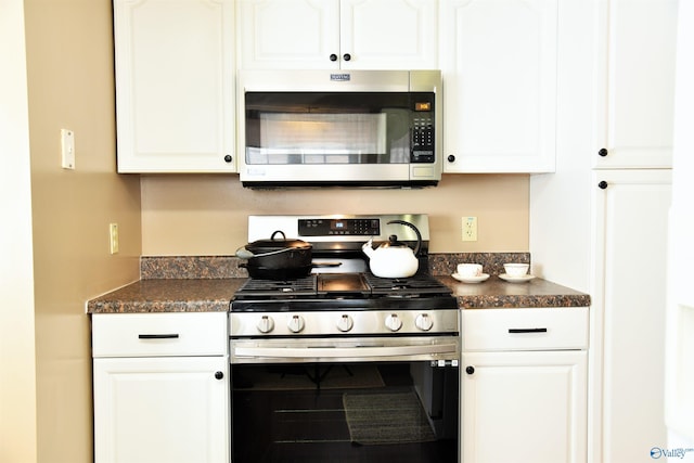 kitchen featuring white cabinetry and appliances with stainless steel finishes