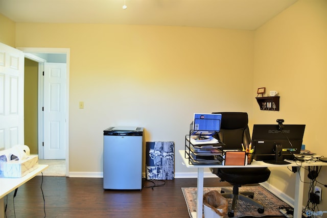 office with dark hardwood / wood-style floors