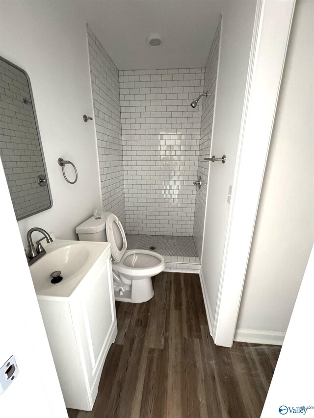2217 Beasley Ave NW, Huntsville, AL 35816 - full bathroom with toilet, a shower stall, wood finished floors, and vanity