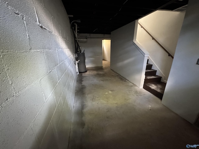 2217 Beasley Ave NW, Huntsville, AL 35816 - below grade area featuring water heater, stairs, and concrete block wall