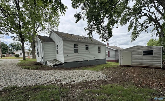 2217 Beasley Ave NW, Huntsville, AL 35816 - rear view of property with a shed and an outdoor structure