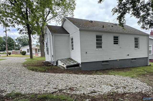 2217 Beasley Ave NW, Huntsville, AL 35816 - view of property exterior featuring roof with shingles